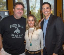 Country singer Vince Gill poses with Matt Deaton, a financial advisor in Phoenix, and his wife.