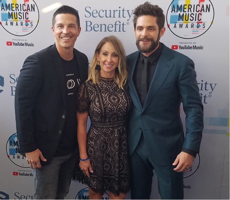 Thomas Rhett, an American country music singer, with financial advisor Matt Deaton on the American Music Awards red carpet.
