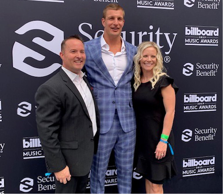Damon Roberts, a financial advisor in Phoenix, with Rob Gronkowski, a former player for the New England Patriots.